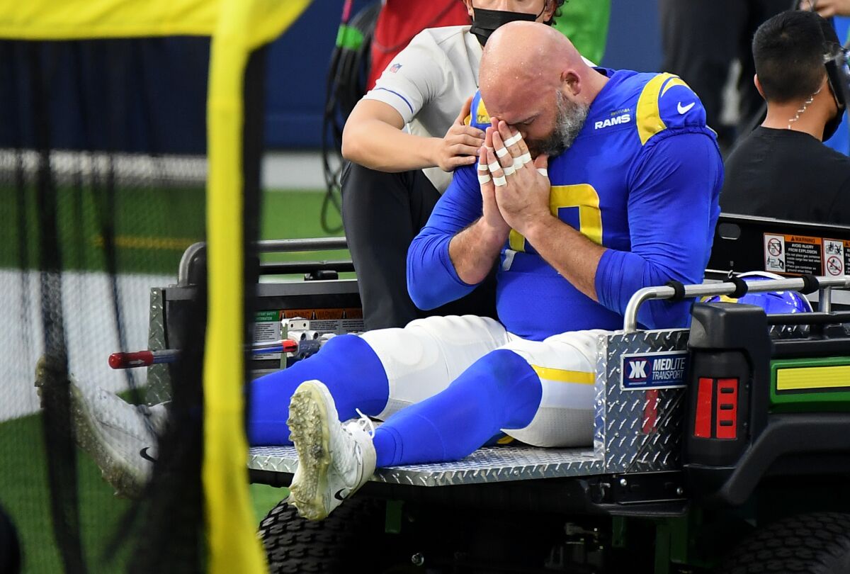 Andrew Whitworth is carted off the field after a suffering an injury against the Seahawks in the second quarter.