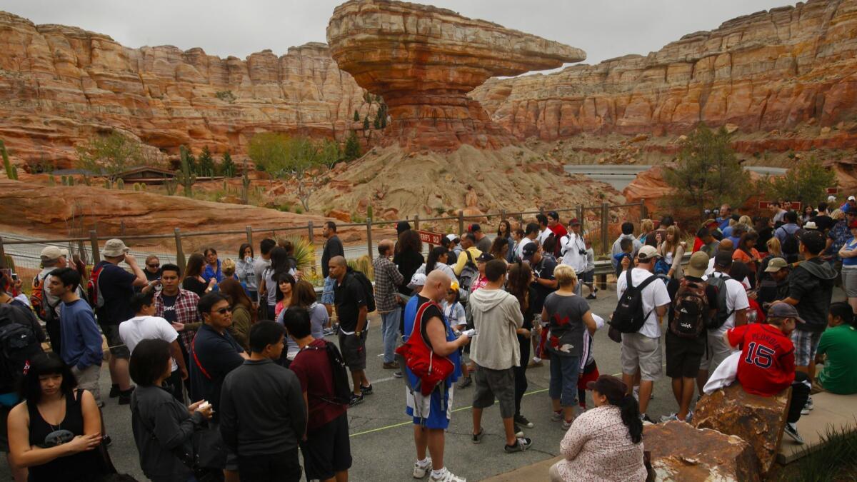 Vistors wait for the new Radiator Springs Racers in Cars Land to open at Disney California Adventure Park on opening day, June 15, 2012.