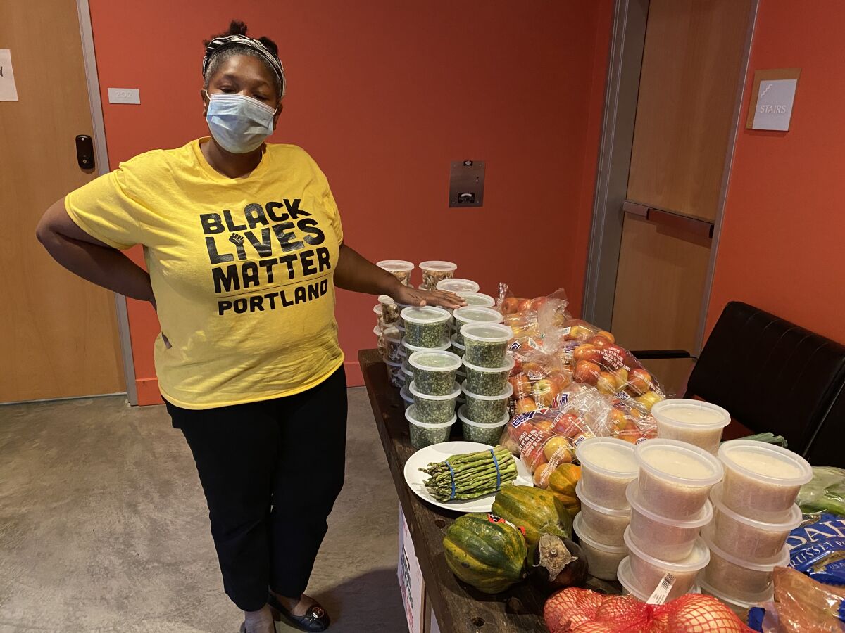 Rachelle Dixon, who heads Black Lives Matter in Portland, says her volunteers are giving out food, not smashing windows.