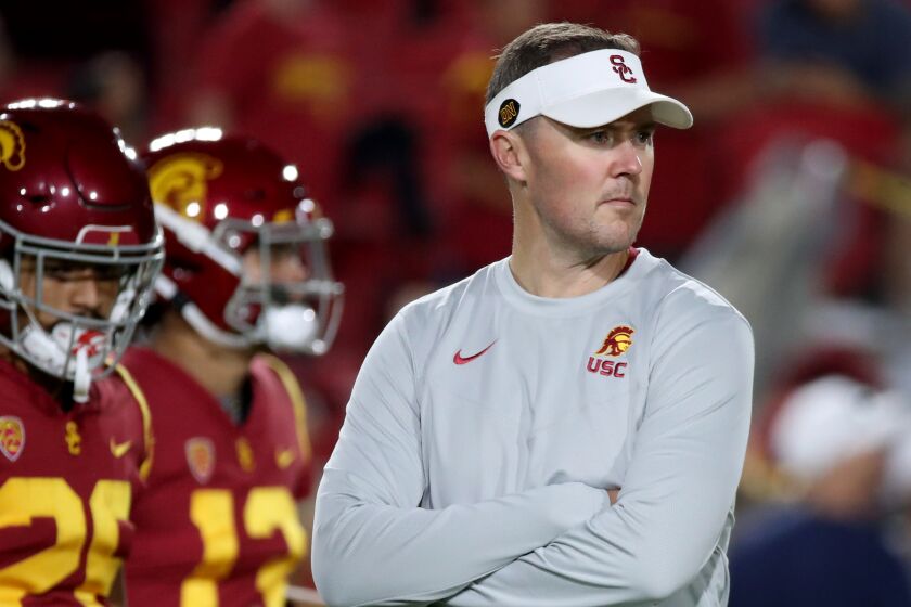 LOS ANGELES, CALIF. - OCT. 1, 2022. USC head coach Lincoln Riley watches the Trojans warm up.