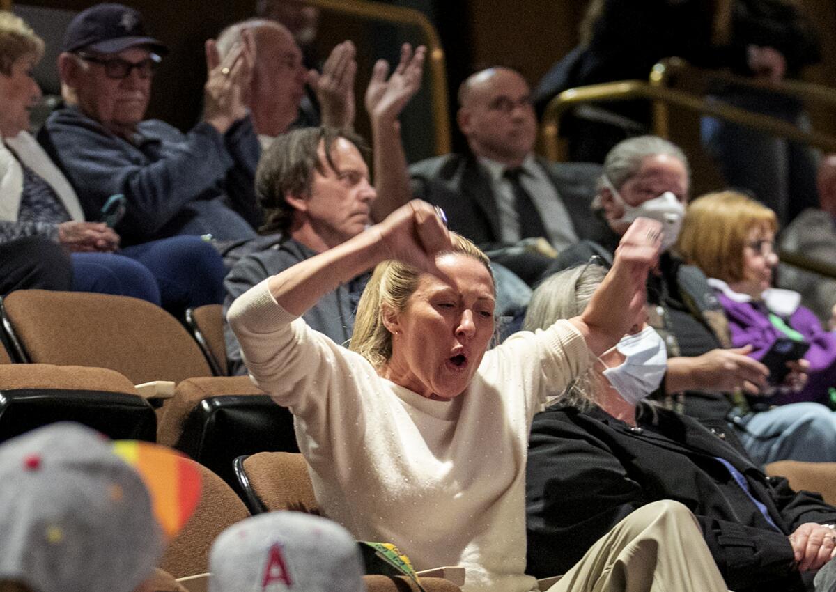 Braunwyn Windham-Burke, from the Real Housewives of Orange County, reacts to a speaker during public comments on Tuesday.