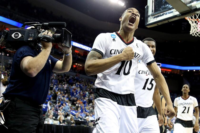 Cincinnati guard Troy Caupain reacts after scoring against Purdue to send the game into overtime Thursday night. The Bearcats would beat the Boilermakers, 66-65.