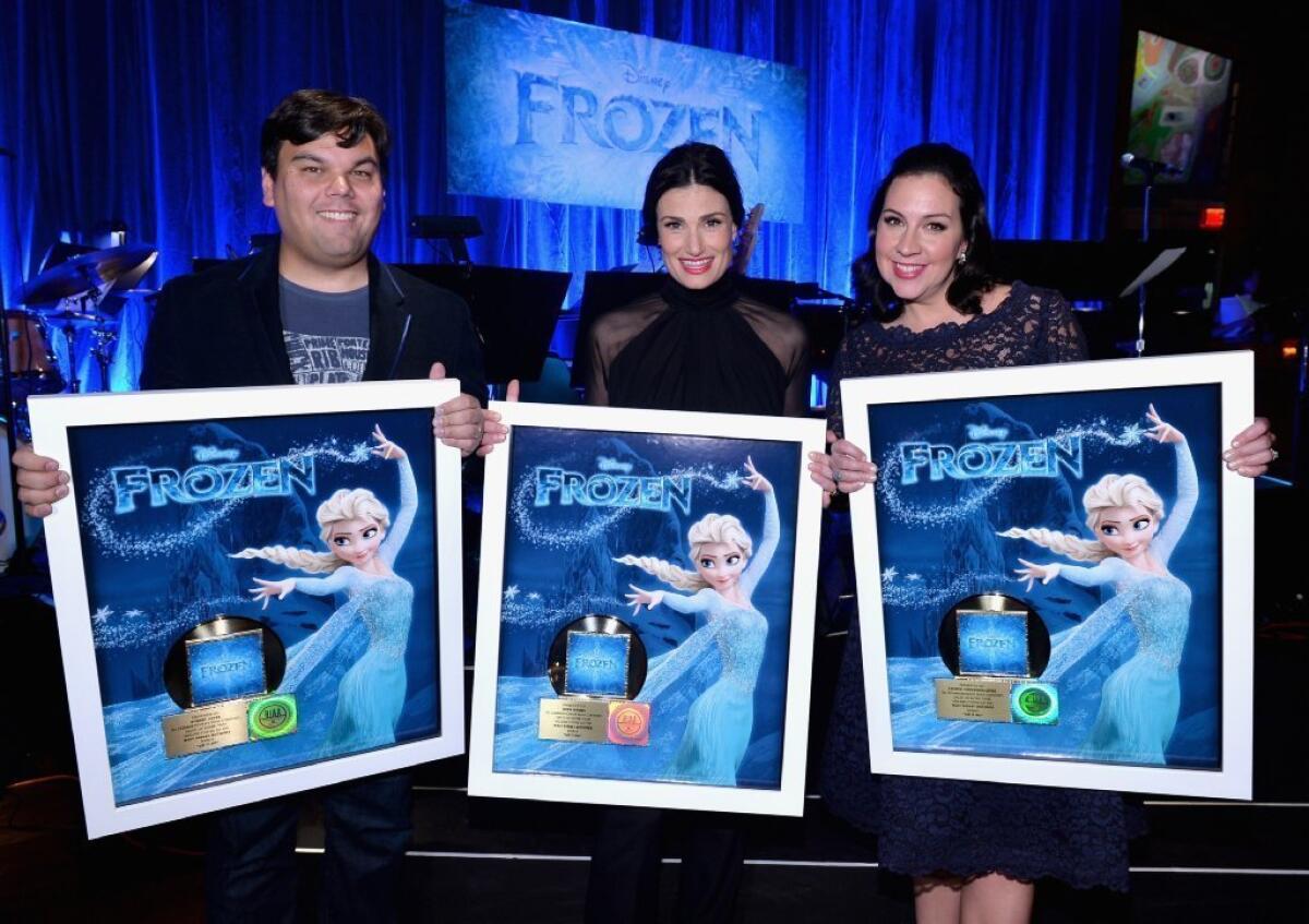 Idina Menzel, center, with "Frozen" songwriters Robert Lopez and Kristen Anderson-Lopez.