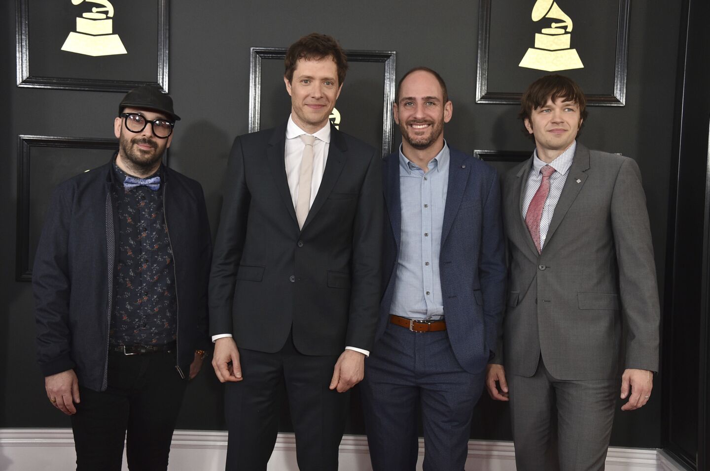 From left, Tim Nordwind, Damian Kulash, Dan Konopka, and Andy Ross of OK Go arrive at the 59th Grammy Awards.