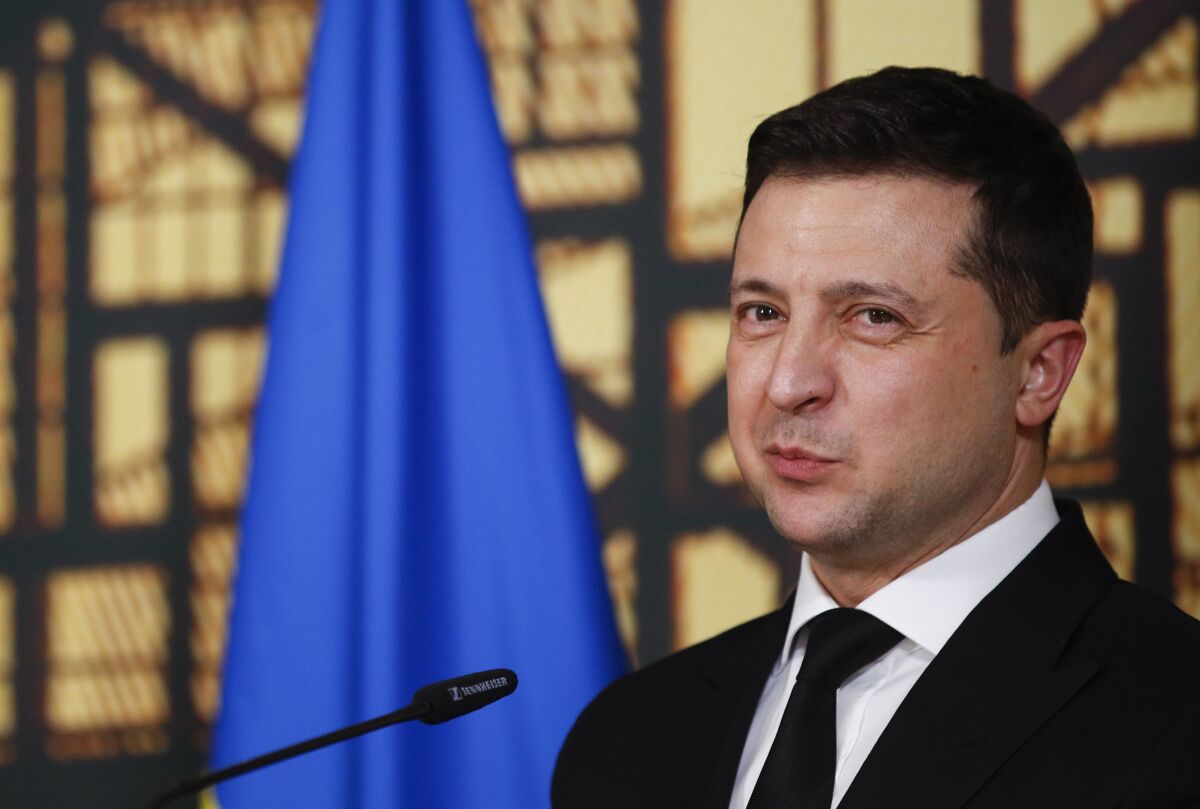 Ukraine's President Volodymyr Zelenskyy speaks during a media conference at an Eastern Partnership Summit in Brussels, Wednesday, Dec. 15, 2021. European Union leaders meet with partner nations on its eastern borders on Wednesday, with the Russian military buildup on Ukraine's border as the main point of focus. (Johanna Geron, Pool Photo via AP)