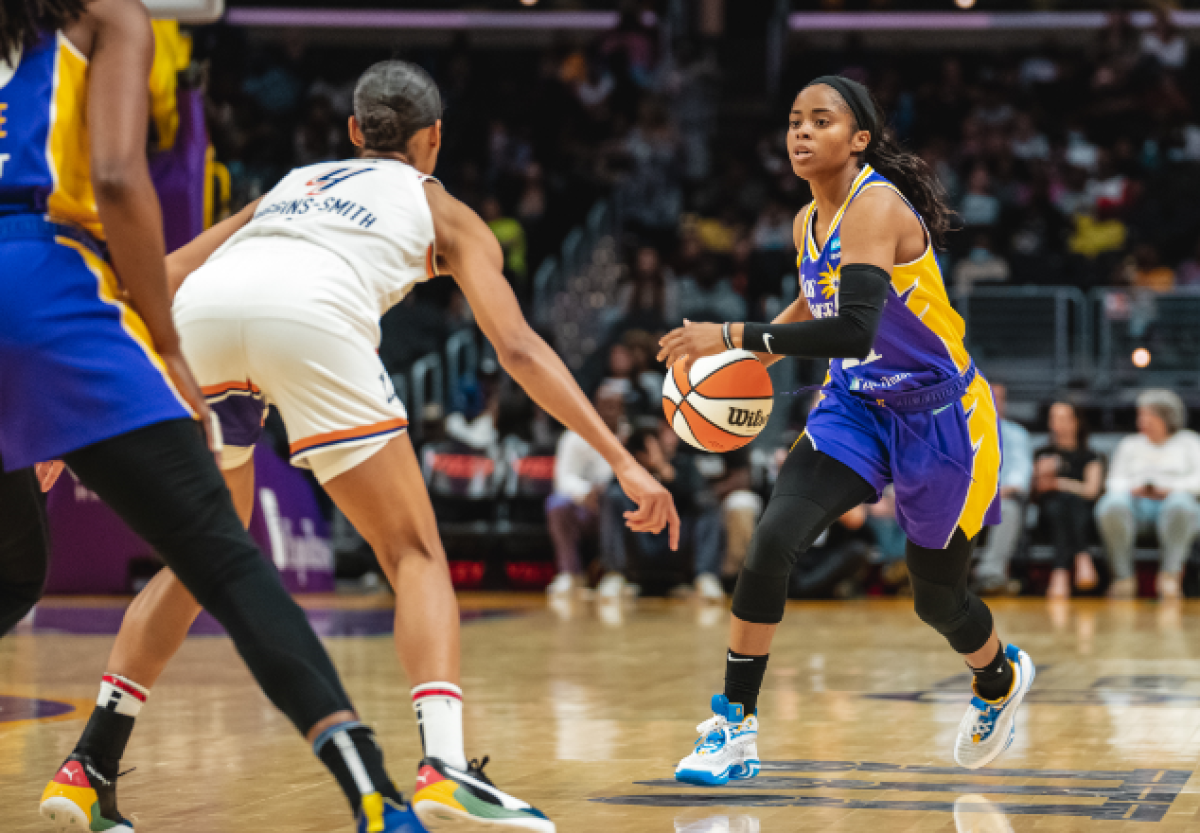 Jordin Canada drives against Phoenix's Skylar Diggins-Smith during the Sparks' 99-94 win Wednesday at Crypto.com Arena.