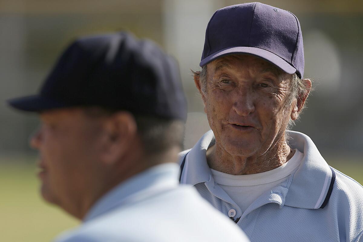 Umpire Jim Pemberton mans the base paths during a game between Canoga Park and San Fernando High Schools.