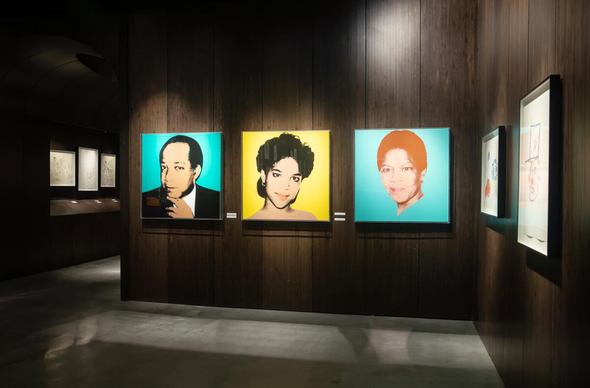 A trio of portraits painted by Andy Warhol.