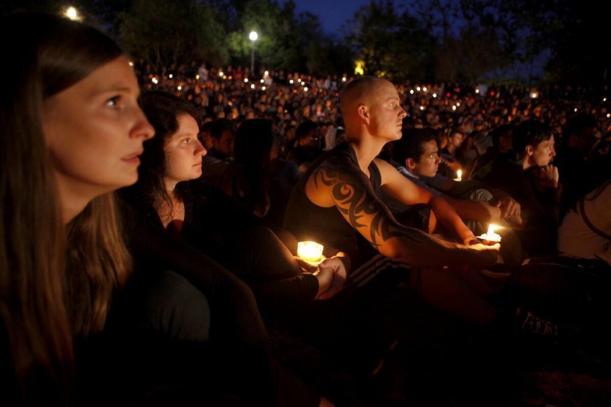 UC Santa Barbara students gather for a candlelight vigil Saturday night to remember those killed in the Isla Vista shooting rampage Friday night.