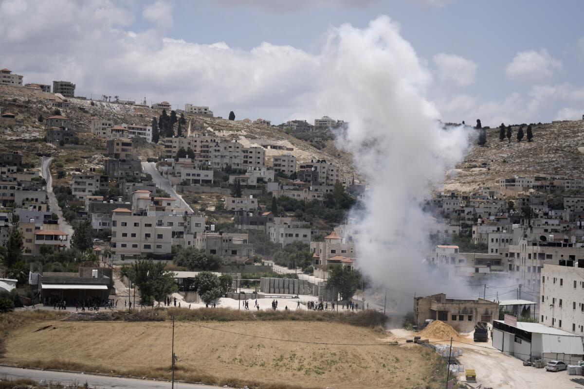 Smoke rising in the West Bank city of Jenin during fighting between Israeli forces and Palestinian militants