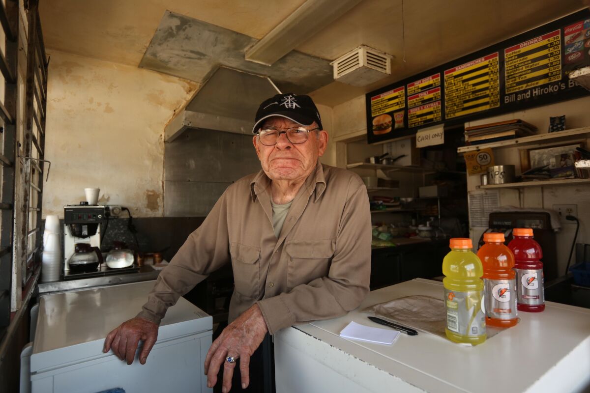 Bill Elwell of Bill's Burgers waits for customers to order takeout at his Van Nuys burger stand.