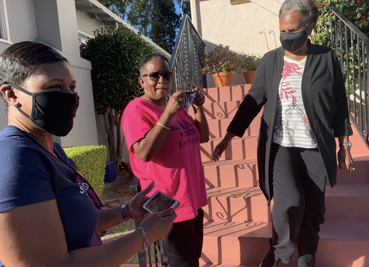 Saniyyah Smith, Sharon McGaffie and Judy Robinson stand on the steps of McGaffie's and Robinson's mother's home. 