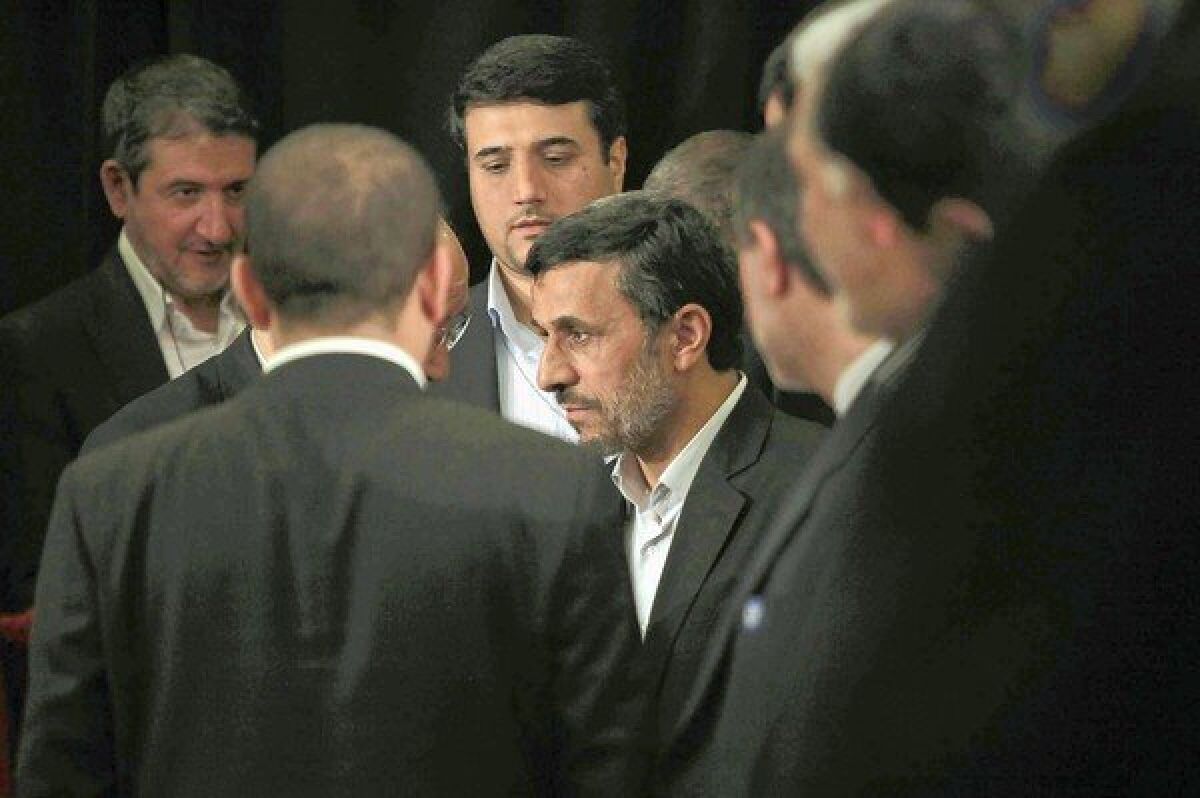 Iranian President Mahmoud Ahmadinejad leaves a news conference at New York's Warwick Hotel. Ahmadinejad's annual address at the U.N. General Assembly lacked its customary fire.