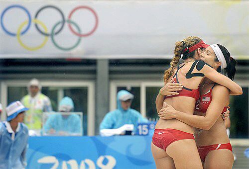 Kerri Walsh and Misty May-Treanor congratulate each other after winning their first match against Japan in preliminary play on Aug. 10 in Beijing.