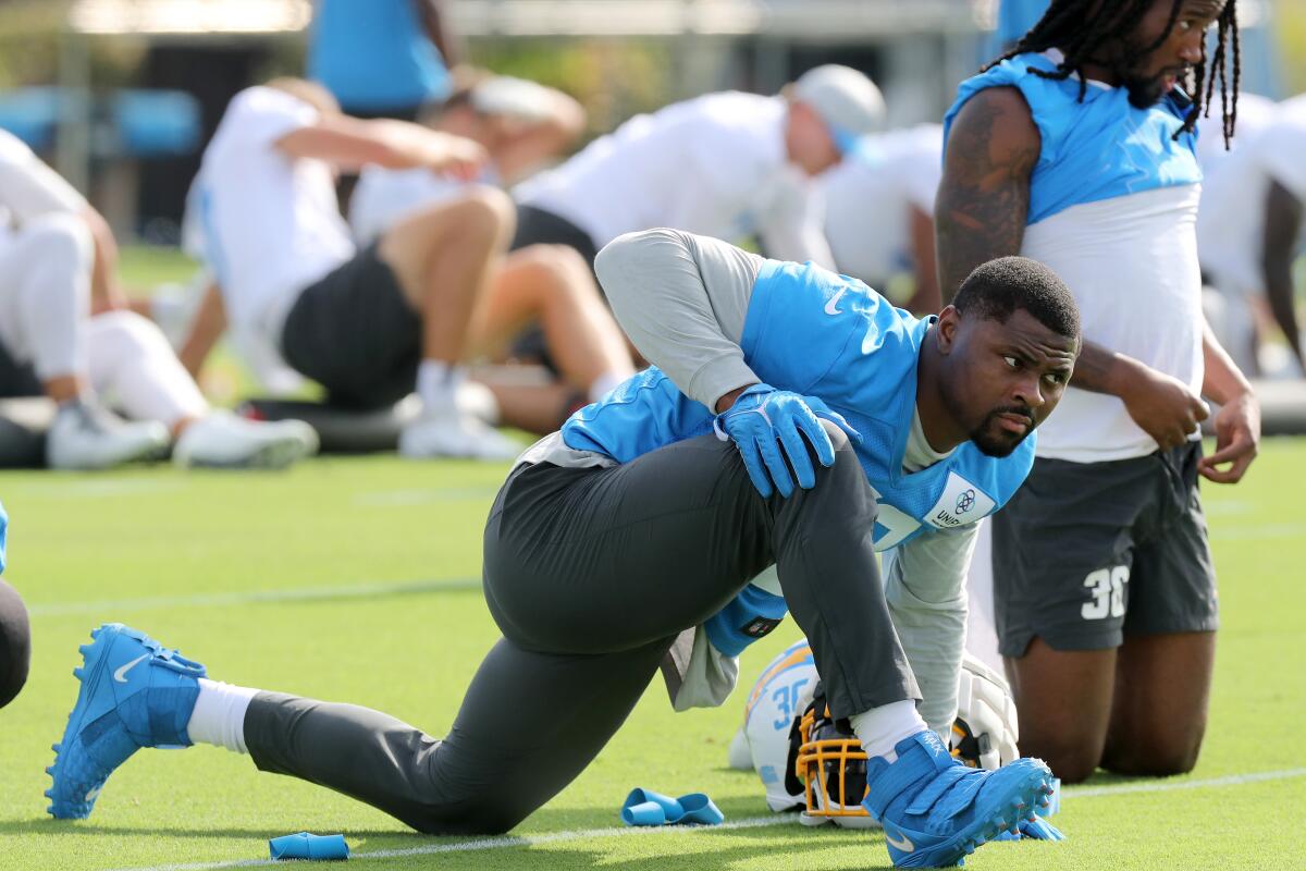 Linebacker Khalil Mack (52) stretches out during the first day of Los Angeles Chargers training camp Wednesday.