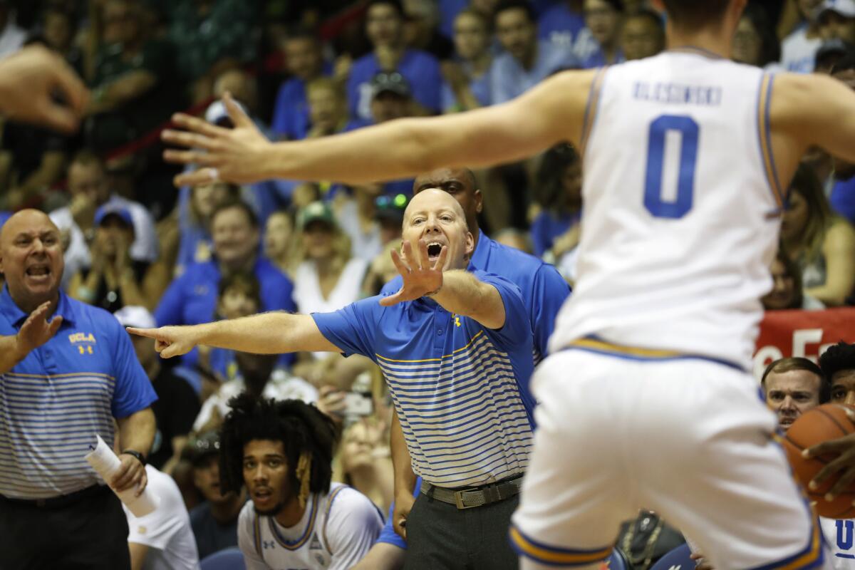 Mick Cronin coaches the Bruins against Michigan State on Nov. 27 in Lahaina, Hawaii. 