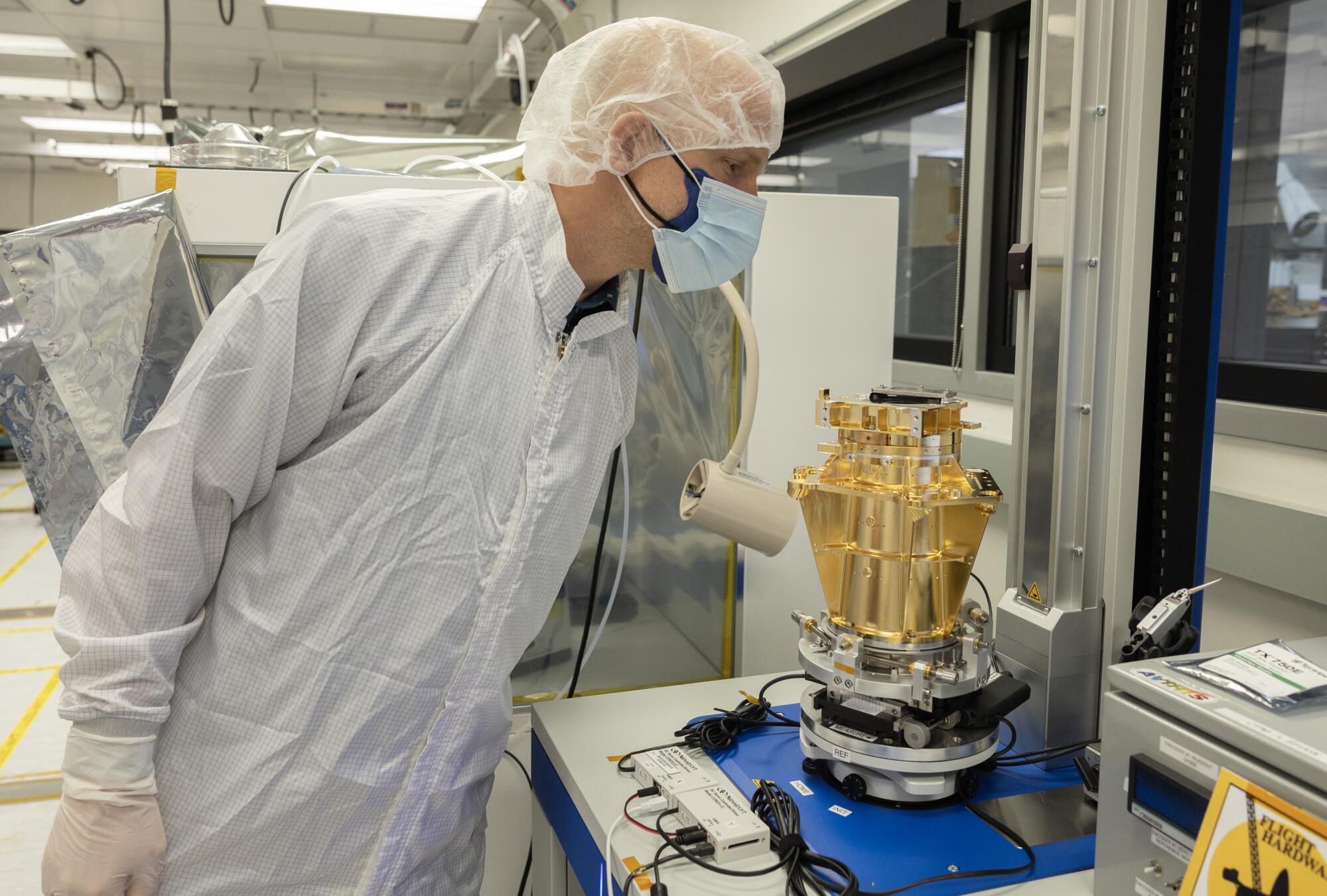 Caltech professor Christian Frankenberg peers into the AVIRIS-5.