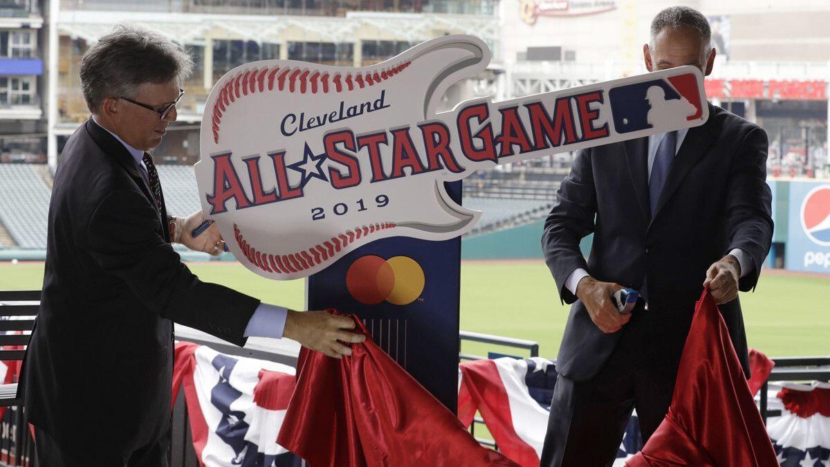 Cleveland Indians owner Paul Dolan, left and Tony Petitti, MLB Deputy Commissioner, Business & Media, unveil the 2019 All-Star logo on Tuesday in Cleveland.