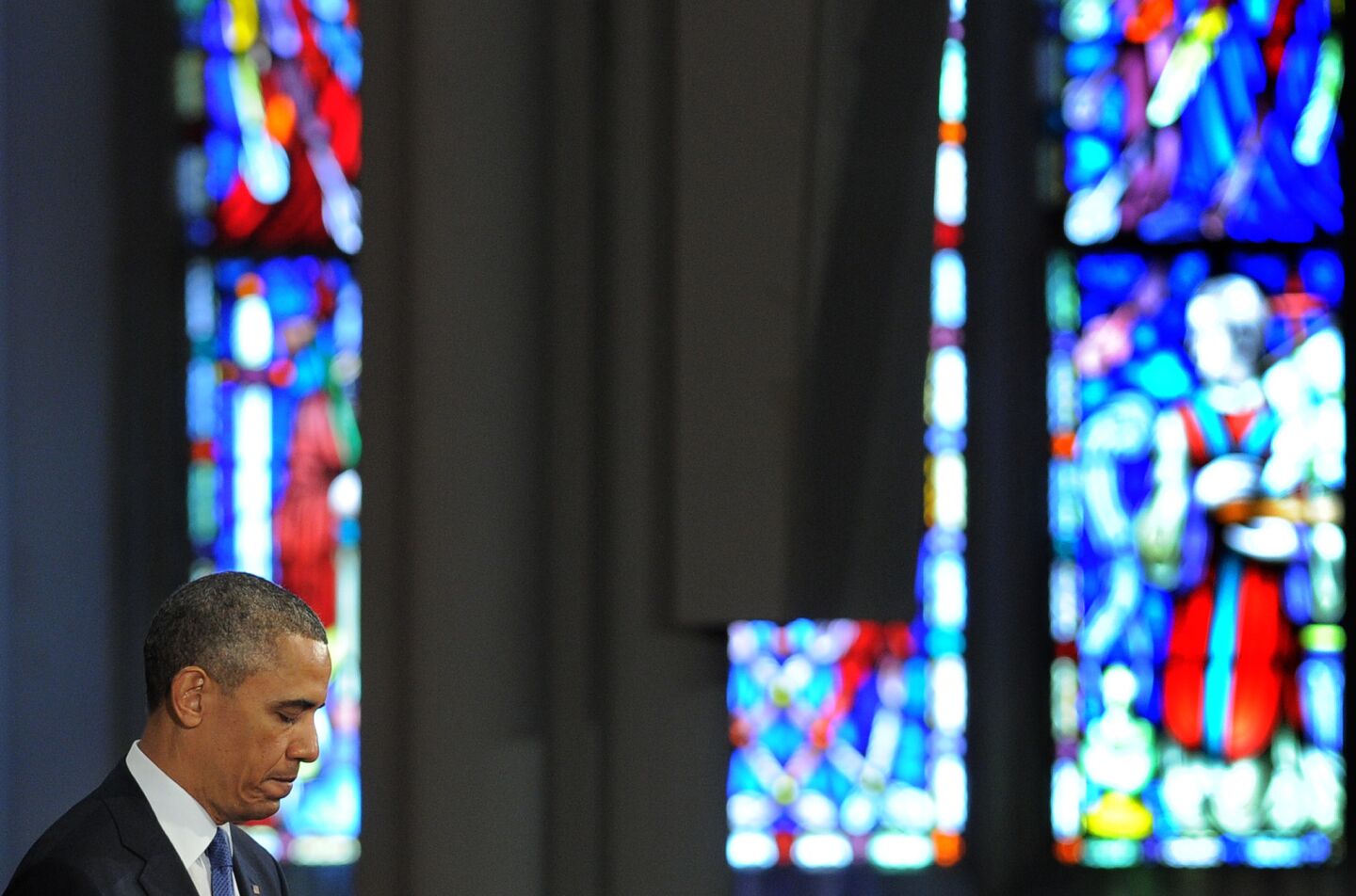 President Obama pauses while speaking at "Healing Our City: An Interfaith Service." The service, dedicated to victims of the Boston Marathon bombing, was held at the Cathedral of the Holy Cross in Boston.