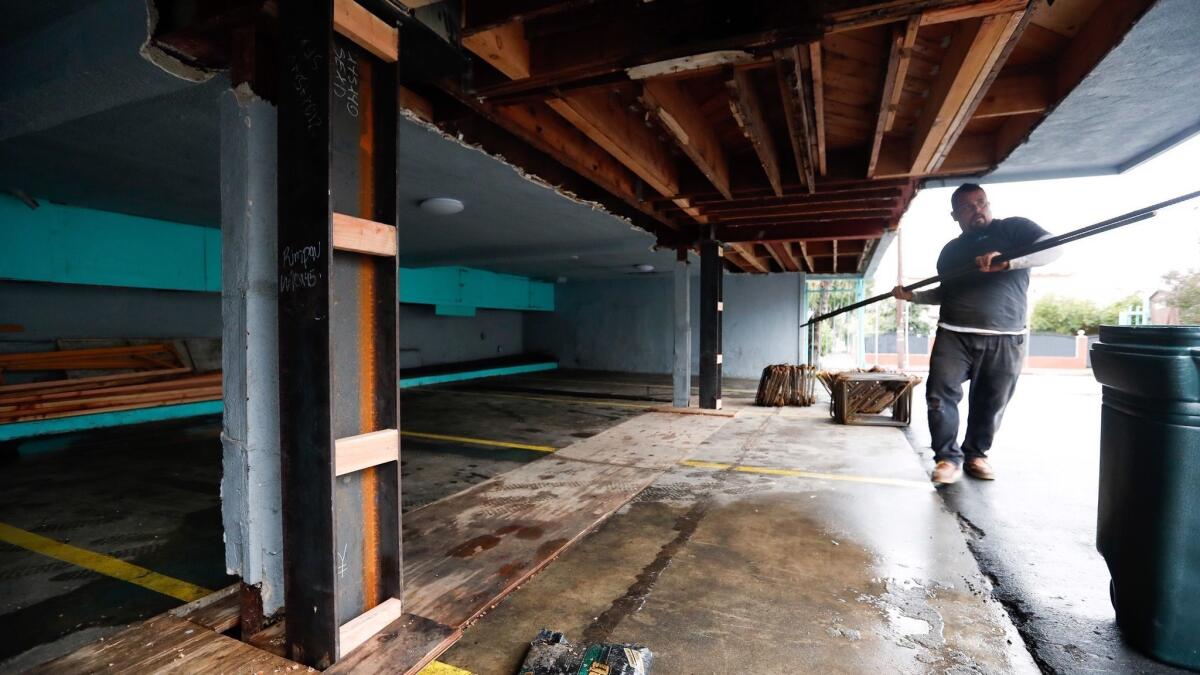 Installing steel columns, as done by Optimum Seismic in Mid-City, helps an apartment stay up in an earthquake.