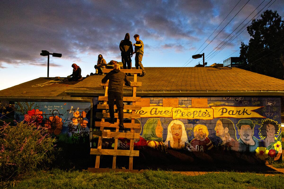 Activists gather on a rooftop in People's Park.