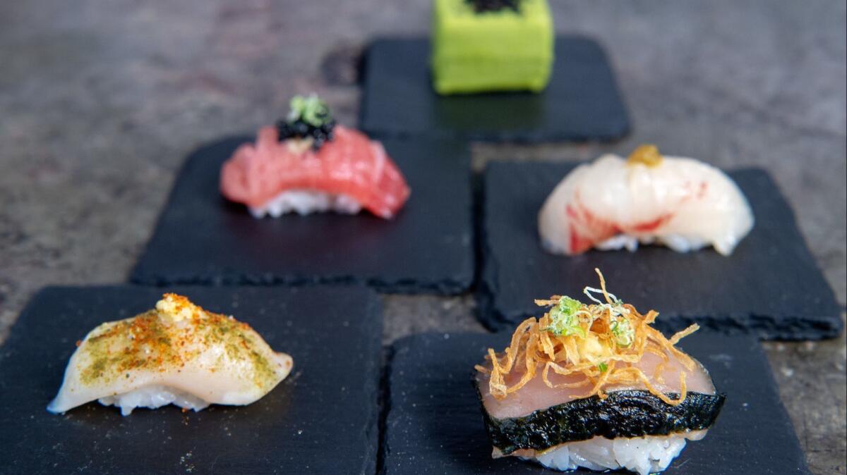 (Counterclockwise from bottom right) The smoked albacore, giant clam, sesame green tea frozen cookie, chu toro and the shima-aji from Sushi Bar.