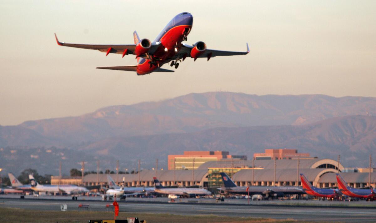 Southwest plans to increase daily flights from John Wayne Airport. A plane takes off in this 2007 file photo.