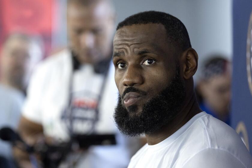 LeBron James of the Los Angeles Lakers listens to a question from a reporter during training camp for the United States men's basketball team Saturday, July 6, 2024, in Las Vegas. (AP Photo/Steve Marcus)