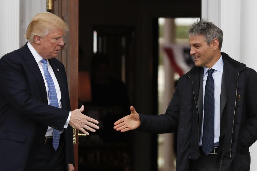 President-elect Donald Trump, left, shakes hands with Ari Emanuel as he leaves the Trump National Golf Club Bedminster clubhouse, Sunday, Nov. 20, 2016 in Bedminster, N.J.. (AP Photo/Carolyn Kaster)