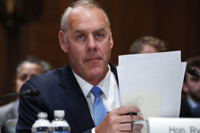 FILE - In this May 10, 2018, file photo, Interior Secretary Ryan Zinke arrives for a Senate Appropriations subcommittee hearing on the FY19 budget on Capitol Hill in Washington. An internal watchdog has cleared IZinke of wrongdoing following a complaint that he redrew the boundaries of a national monument in Utah to benefit a former state lawmaker and political ally. The Interior Departmentâs office of inspector general says it found no evidence that Zinke gave former state Rep. Mike Noel preferential treatment in shrinking the boundaries of Utahâs Grand Staircase-Escalante National Monument. (AP Photo/Jacquelyn Martin, File)