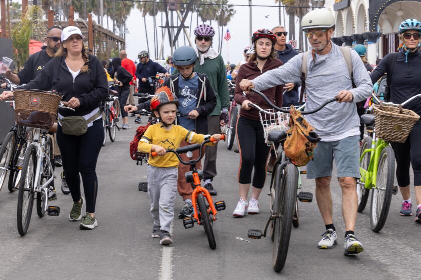 Venice, CA - April 21: Walkers, joggers, cyclists and skaters, enjoy the Venice corridor during CicLAvia's 51st event on Sunday, April 21, 2024 in Venice, CA. (Brian van der Brug / Los Angeles Times)