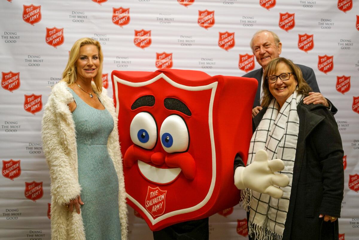 Advisory board member, Larry Buster and guests with the Salvation Army Orange County's mascot, Sal, at "A Night for Others."