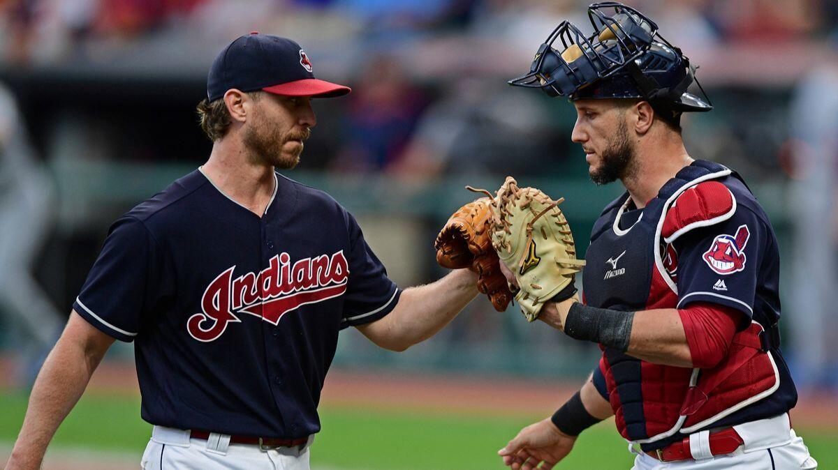 Cleveland Indians starting pitcher Josh Tomlin, left, is congratulated by catcher Yan Goes in the first inning against the Kansas City Royals on Thursday.