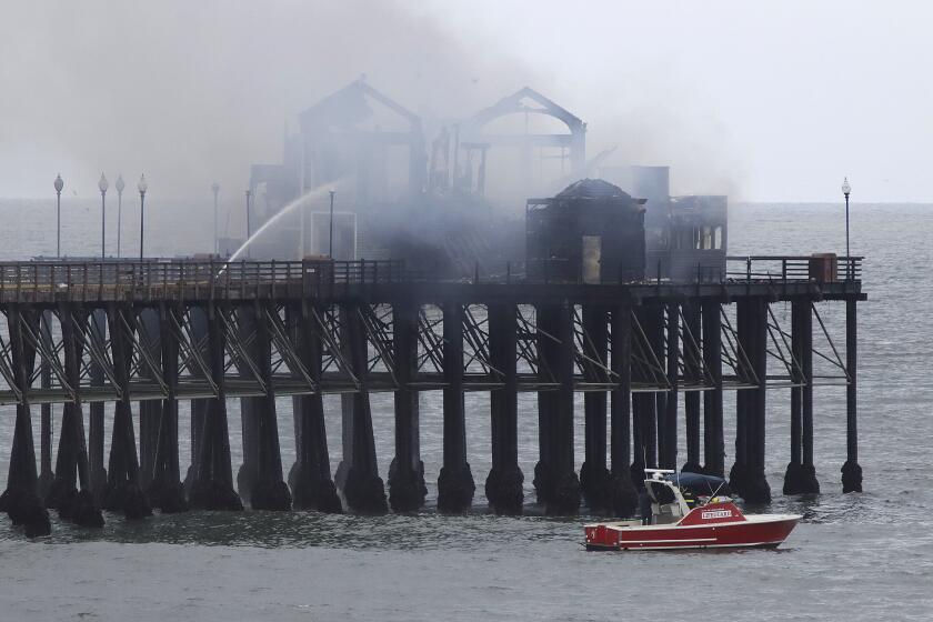 Oceanside, CA_4_26_24_The Oceanside Pier continues to burn Friday morning after a fire which started at the end of the pier burned the former Ruby's Diner and The Brine Box. Photo by John Gastaldo for the Union-Tribune