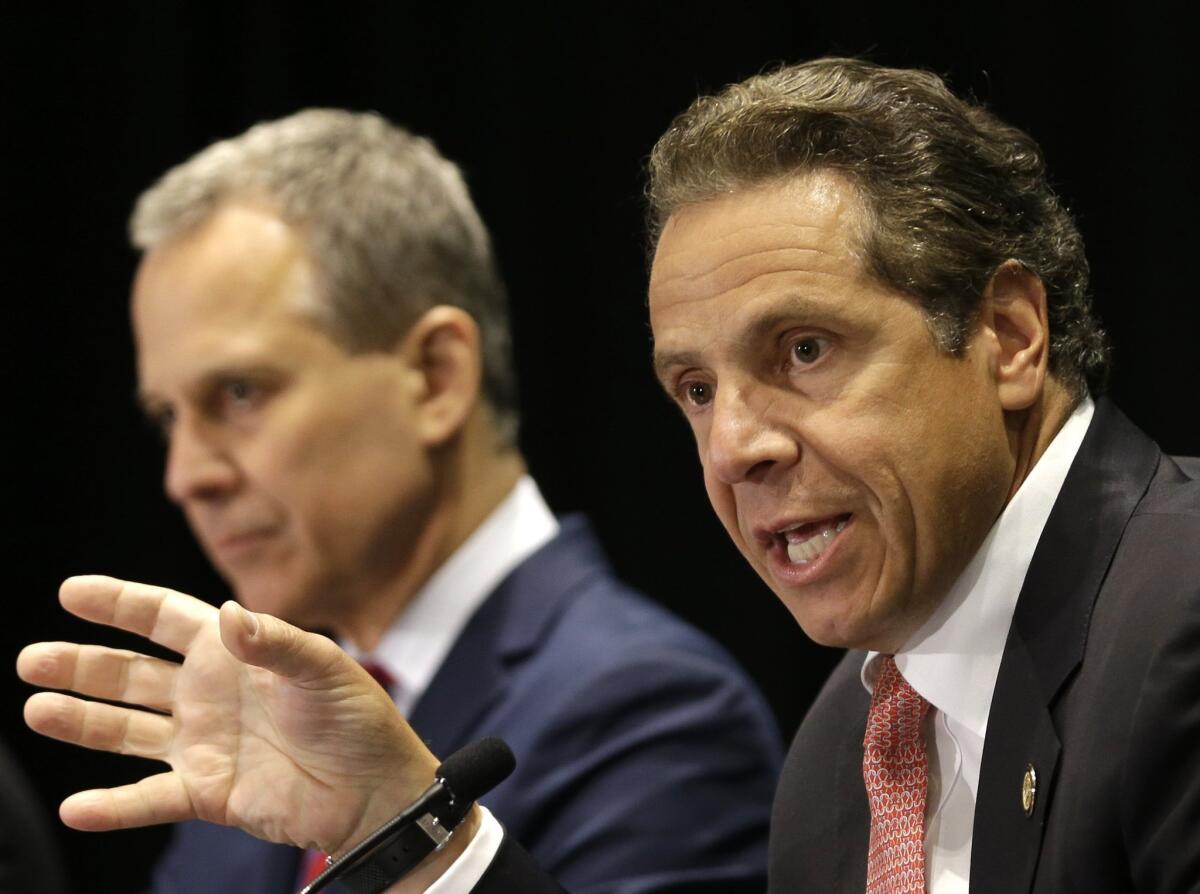 New York Gov. Andrew Cuomo, right, with New York Atty. Gen. Eric Schneiderman.