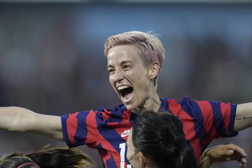 U.S. forward Megan Rapinoe, back, celebrates with midfielder Taylor Kornieck after Kornieck's goal against Colombia during the second half of an international friendly soccer match Saturday, June 25, 2022, in Commerce City, Colo. (AP Photo/David Zalubowski)