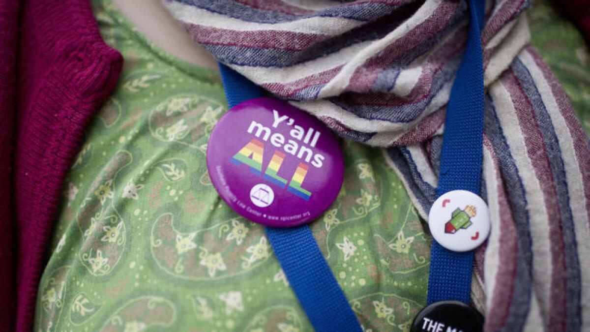 A supporter of same-sex marriage wears her opinion on a button on Feb. 9 in Montgomery, Ala.