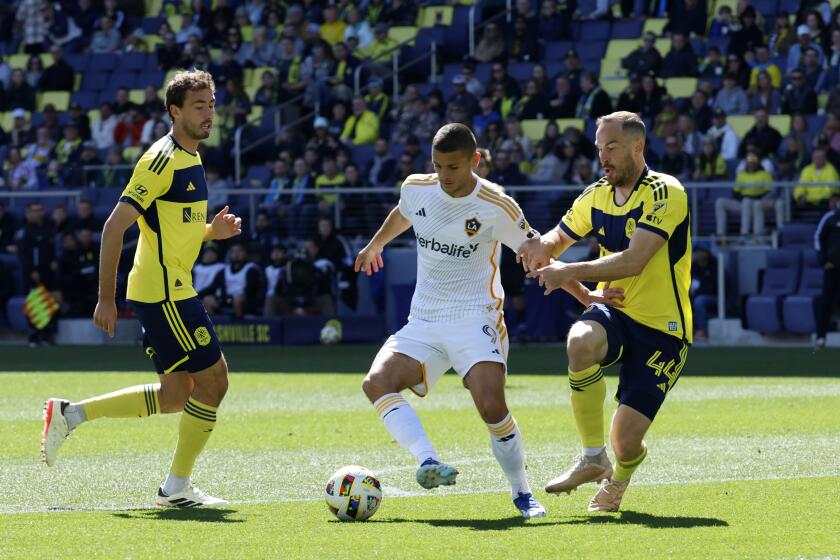 NASHVILLE, TN - MARCH 10: Los Angeles Galaxy forward Dejan Jovelji (9) splits between Nashville SC forward Sam Surridge (9) and Nashville SC defender Brent Kallman (44) during a match between Nashville SC and Los Angeles Galaxy, March 10, 2024, at GEODIS Park in Nashville, Tennessee. (Photo by Matthew Maxey/Icon Sportswire via Getty Images)