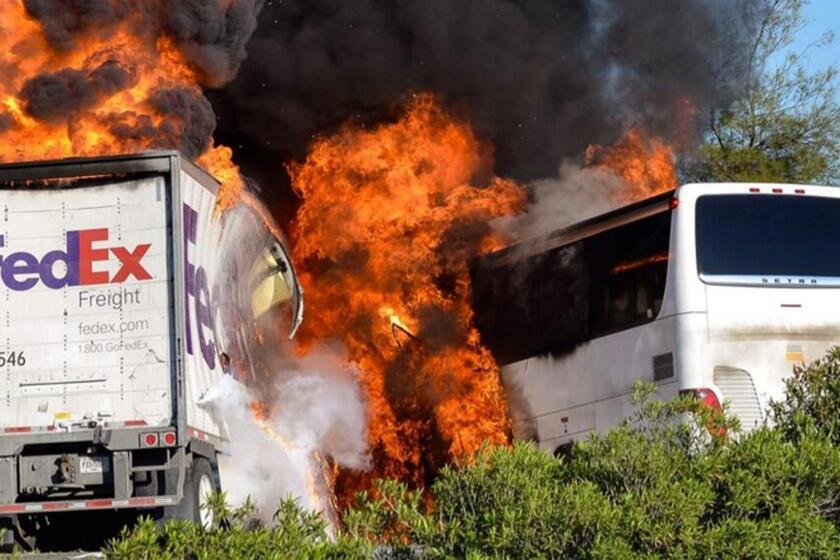 Flames engulf the vehicles just after a head-on crash near Orland, Calif., involving a FedEx truck and a bus carrying Los Angeles-area high school students on a visit to a college.