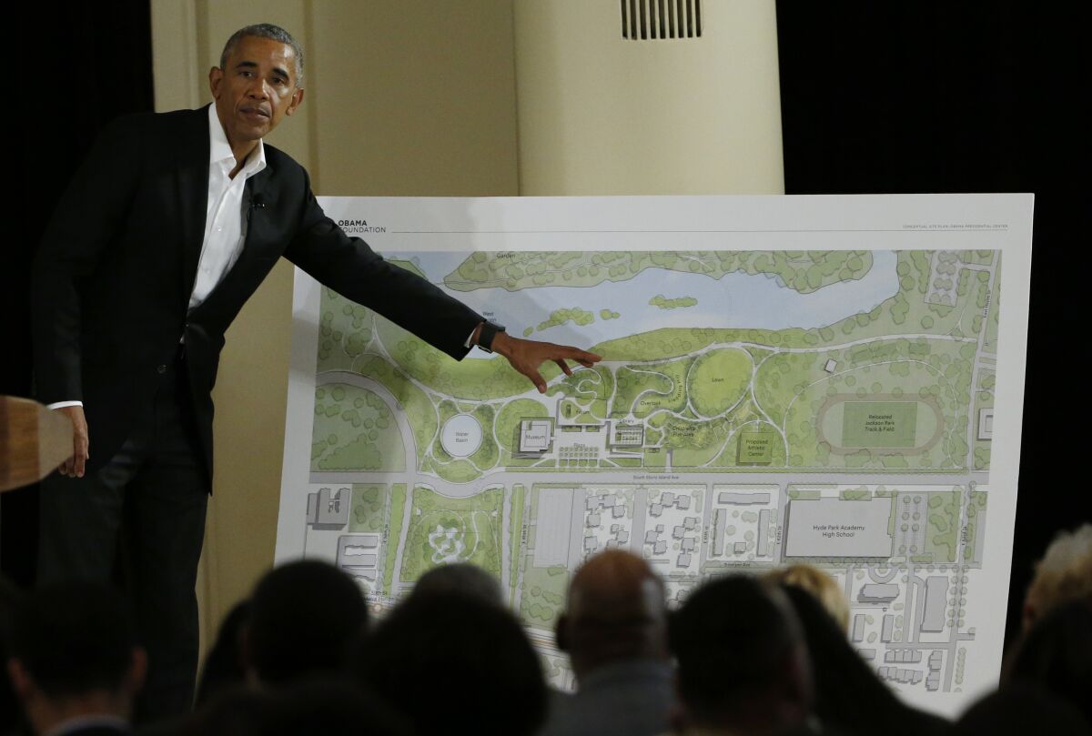 Former President Obama gesturing at blueprint