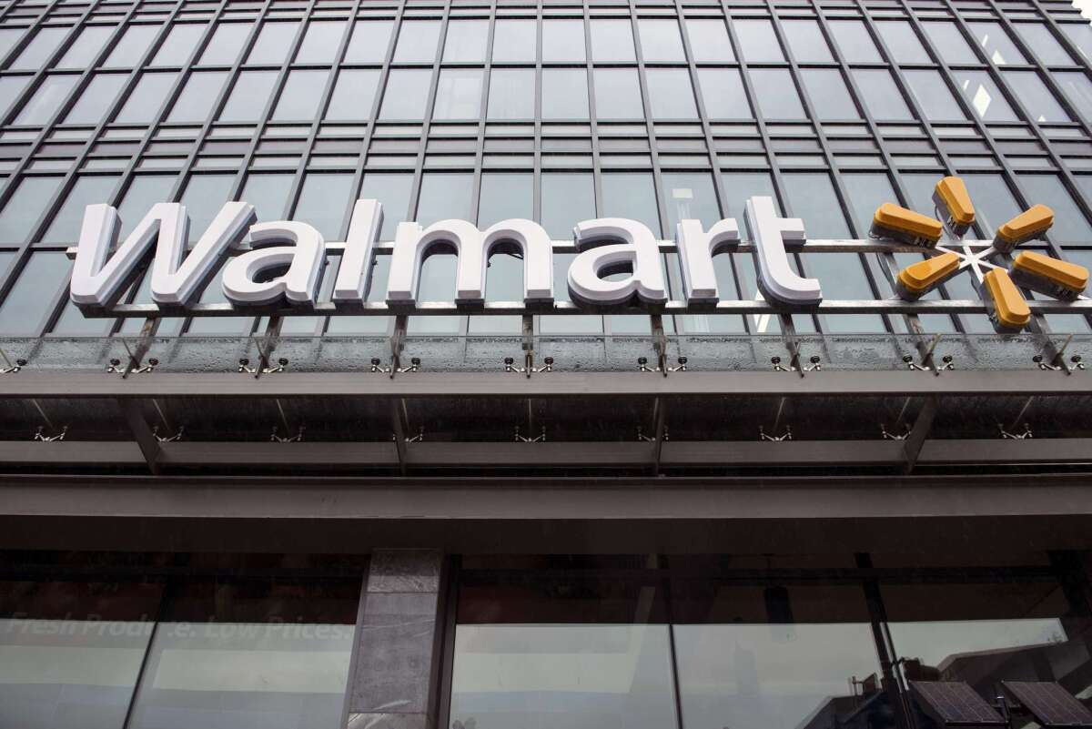 Facade of one of three Wal-Mart stores in Washington, D.C. After opening the stores in more affluent neighborhoods, the big company is abandoning a commitment to open two more in the inner city.