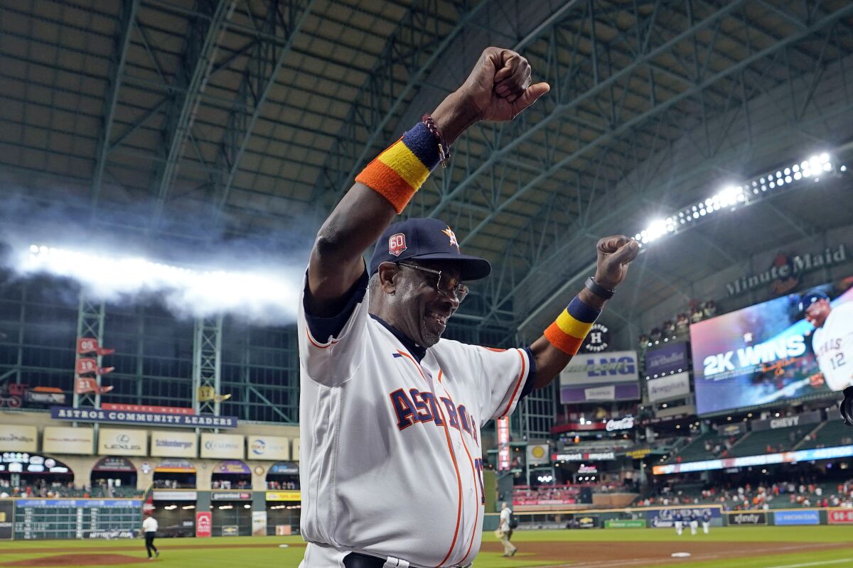 Houston Astros' Dusty Baker Jr. (12) celebrates after a baseball game against the Seattle Mariners Tuesday, May 3, 2022, in Houston. The Astros won 4-0 giving Baker 2,000 career wins. (AP Photo/David J. Phillip)