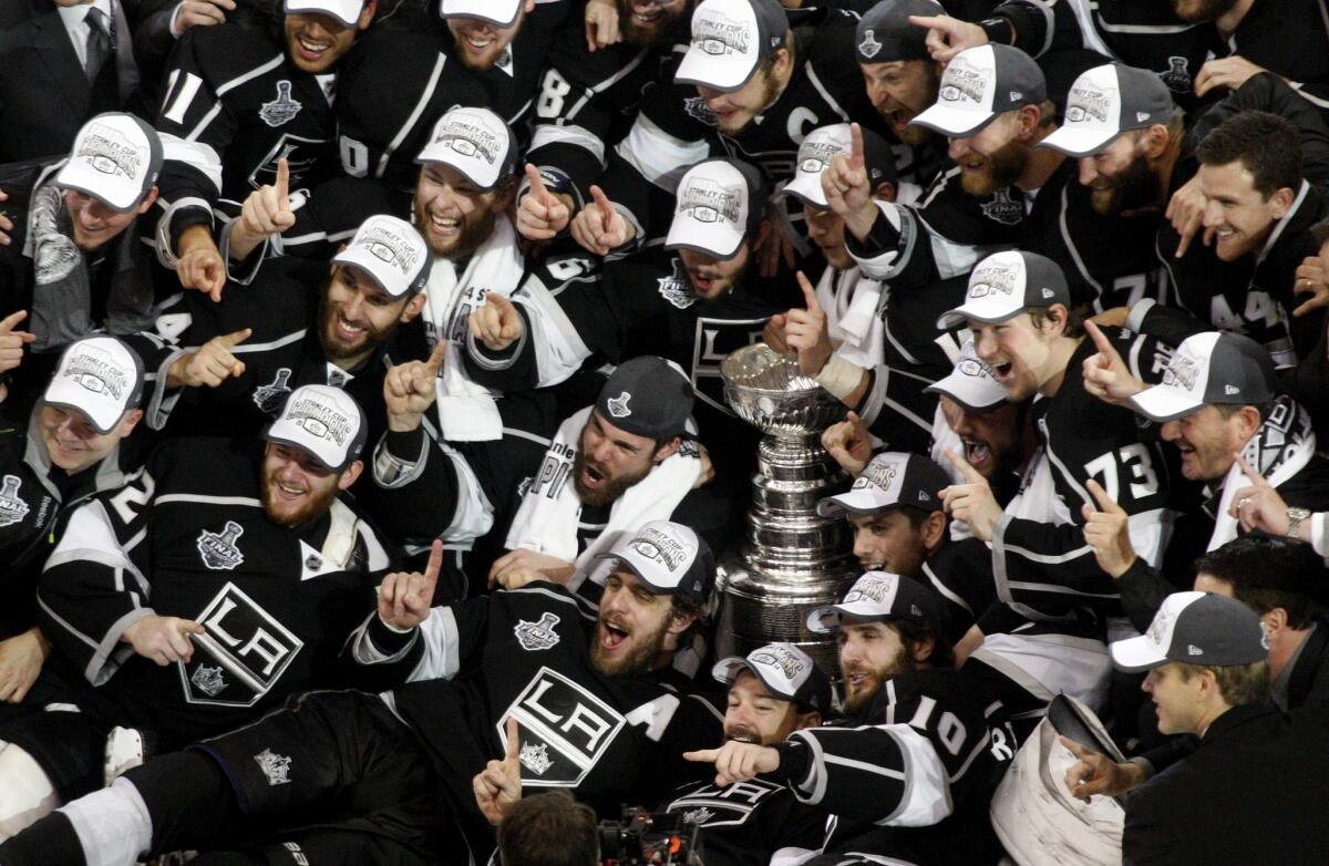 Kings players crowd together for a team photo after winning the Stanley Cup at Staples Center.