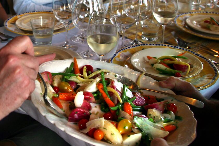 Robert Durell x77020 –– – 065043.FO.0528.sinskey26.RED––NAPA, CA–– Guests dig into a fresh organic vegetable salad topped with Pecorino made by Maria Helm Sinskey, who is the wife of Robert Sinskey, a Napa Valley vineyard owner and winemaker. Helm Sinskey, a renowned chef, prepared a dinner for her friends that included wines from her husband Robert Sinskey's winery. For a story on casual entertaining in the Napa Valley.