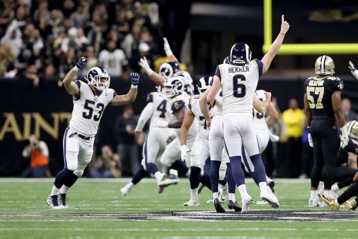 Rams players celebrate after defeating the New Orleans Saints in the NFC championship game on Jan. 20 at the Mercedes-Benz Superdome.