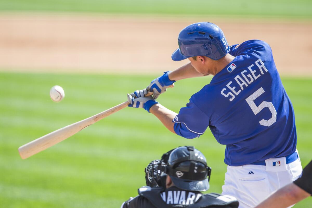 Dodgers shortstop Corey Seager bats during a spring training game against the Chicago White Sox on March 3.