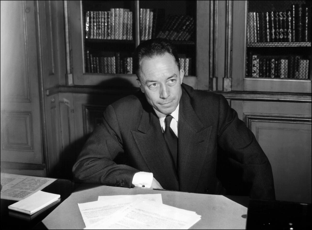 French writer Albert Camus is seen posing for a portrait in Paris.