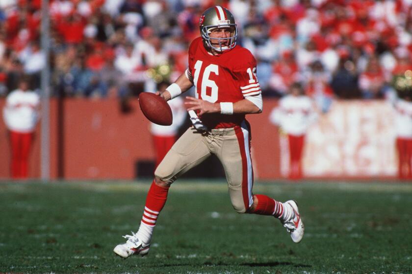 San Francisco 49ers quarterback Joe Montana rolls out to pass at Candlestick Park in 1989. Montana won all four Super Bowls -- XVI, XIX, XXIII and XXIV -- he played in. Montana, Terry Bradshaw and Tom Brady hold the record for most Super Bowl wins by a quarterback.