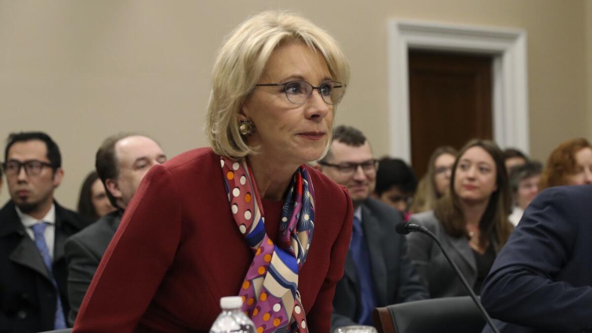 Education Secretary Betsy DeVos testifies at a House committee hearing in 2018.
