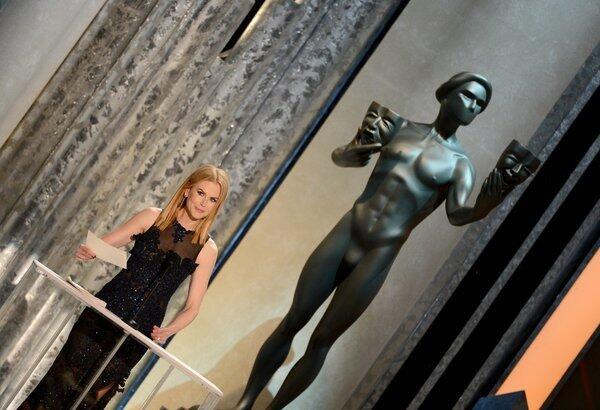 Nicole Kidman presents the first Screen Actors Guild award Sunday at the Shrine Auditorium in Los Angeles. She accepted the award for male actor in a supporting role for "Lincoln's" Tommy Lee Jones, who was absent.